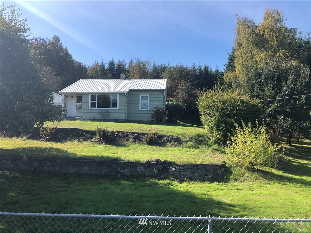 380 Newaukum Valley Road Chehalis, WA 98532 - Photo 1 of 19 a front view of a house with a yard table and chairs