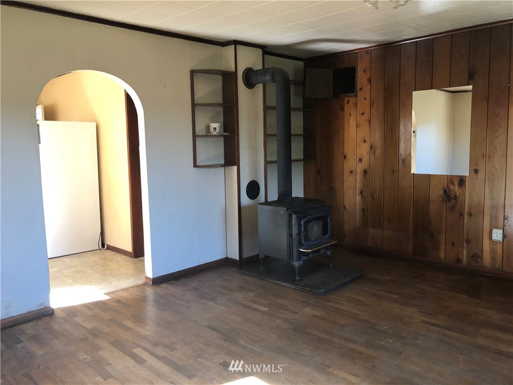 380 Newaukum Valley Road Chehalis, WA 98532 - Photo 11 of 19 a view of empty room with wooden floor and cabinet