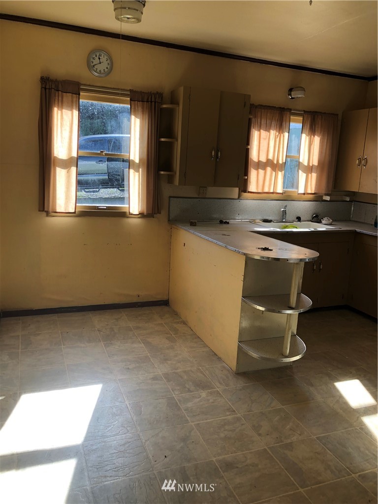 380 Newaukum Valley Road Chehalis, WA 98532 - Photo 15 of 19 a kitchen with a sink cabinets and wooden floor