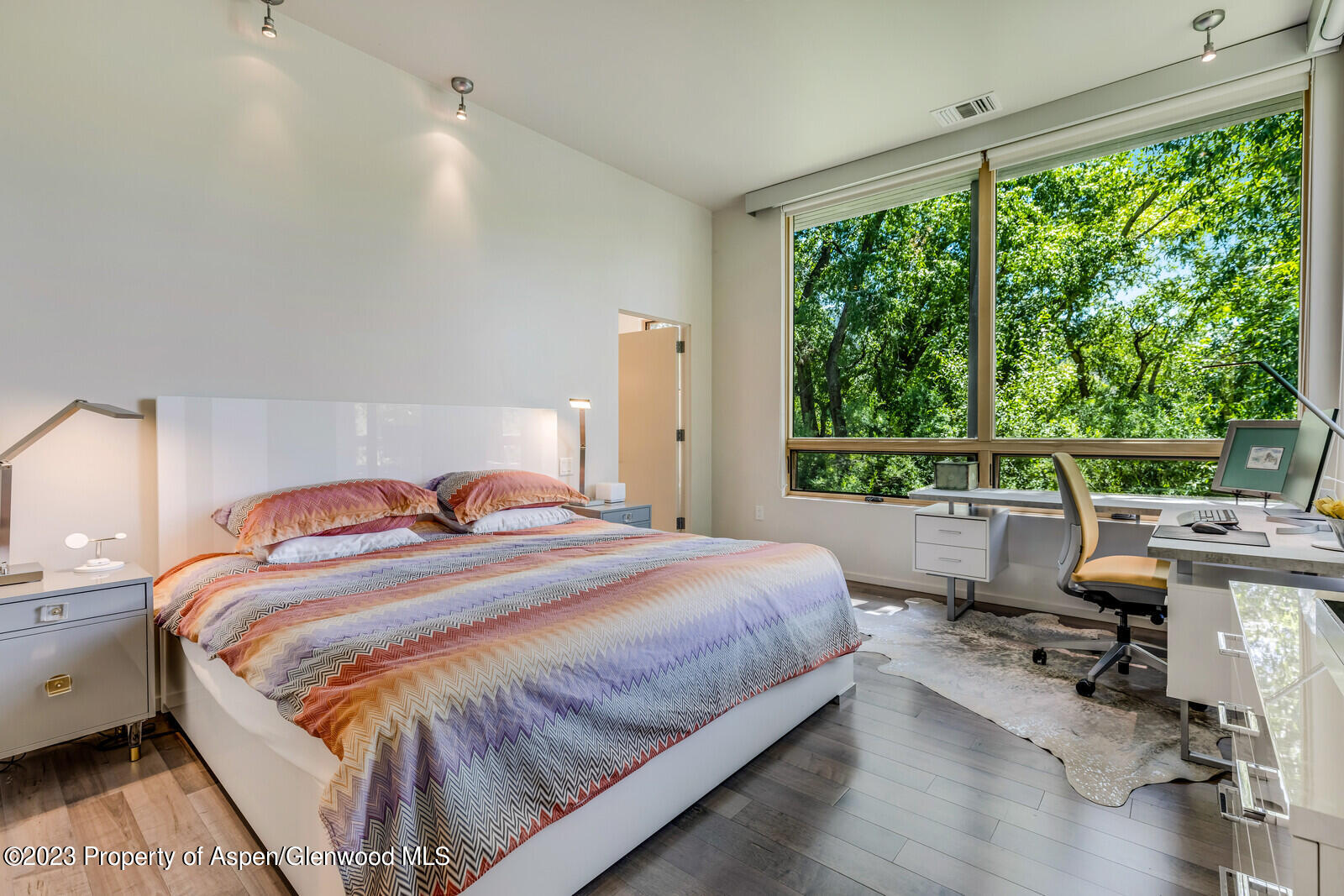 202 Evans Road, Unit 105 Basalt, CO 81621 - Photo 16 of 27 a bedroom with a bed and a large window
