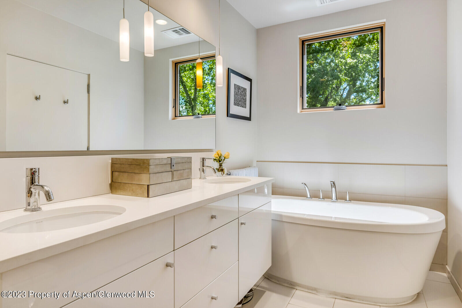 202 Evans Road, Unit 105 Basalt, CO 81621 - Photo 19 of 27 a bathroom with a toilet sink and mirror