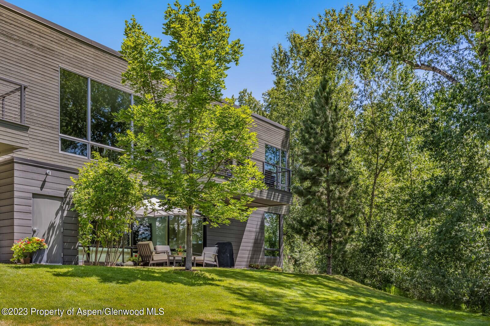202 Evans Road, Unit 105 Basalt, CO 81621 - Photo 26 of 27 a garden with trees in front of it