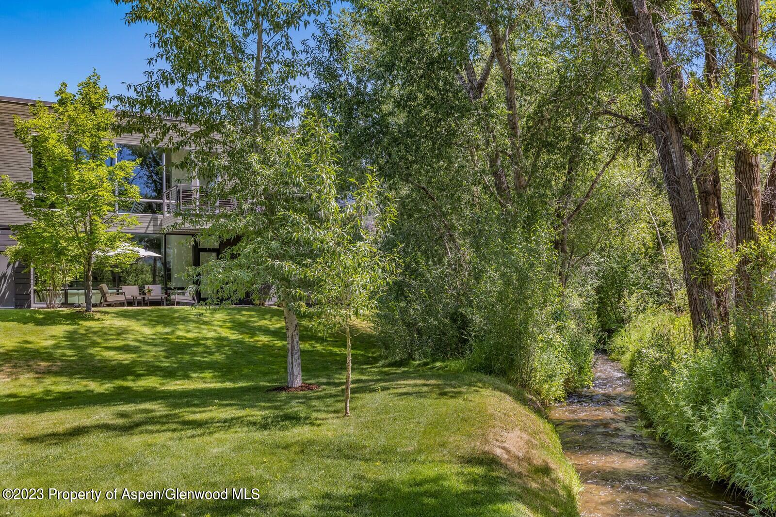 202 Evans Road, Unit 105 Basalt, CO 81621 - Photo 27 of 27 a backyard of a house with lots of green space