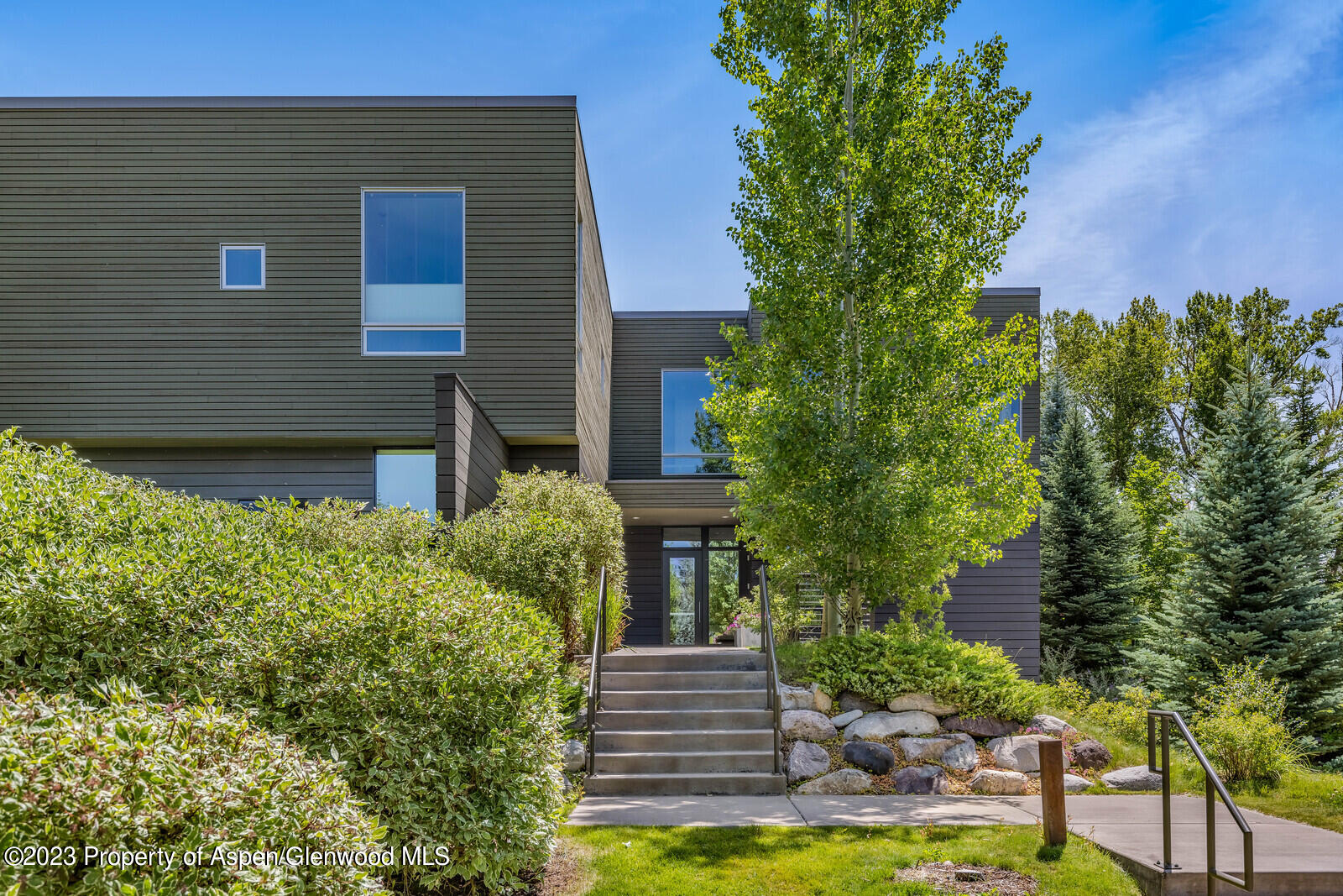 202 Evans Road, Unit 105 Basalt, CO 81621 - Photo 3 of 27 a front view of a house with garden