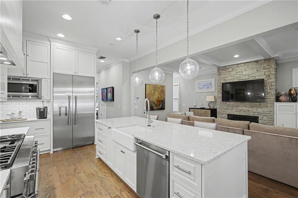 317 Riversedge Drive Atlanta, GA 30339 - Photo 13 of 49 a large kitchen with a large counter top appliances and cabinets