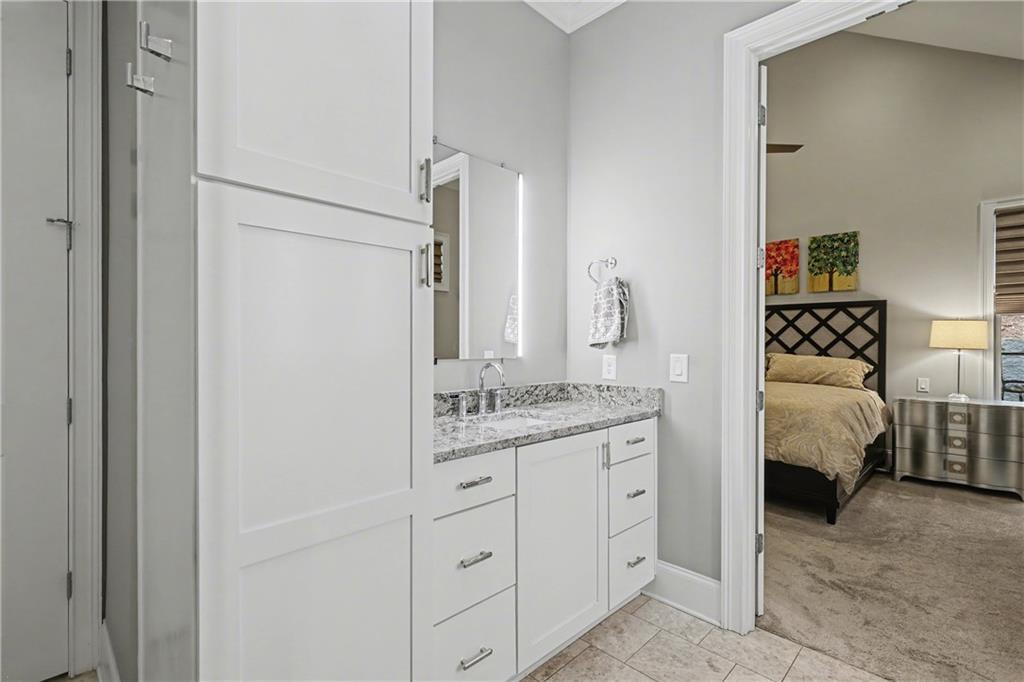 317 Riversedge Drive Atlanta, GA 30339 - Photo 19 of 49 a en suite bathroom with a double vanity sink and a mirror
