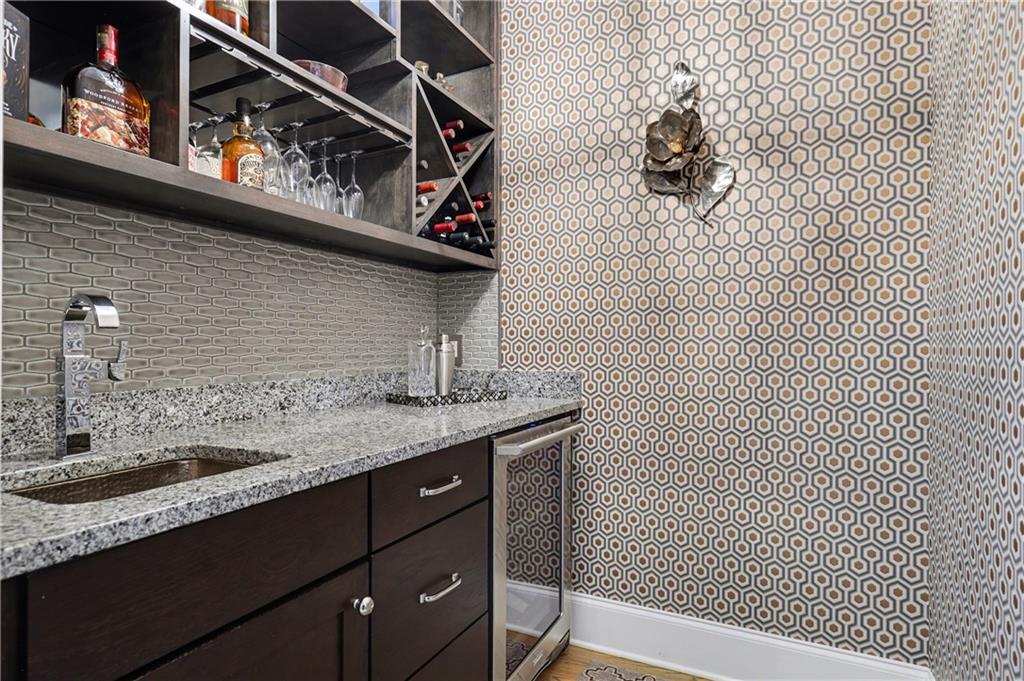 317 Riversedge Drive Atlanta, GA 30339 - Photo 25 of 49 a bathroom with a granite countertop sink and a mirror