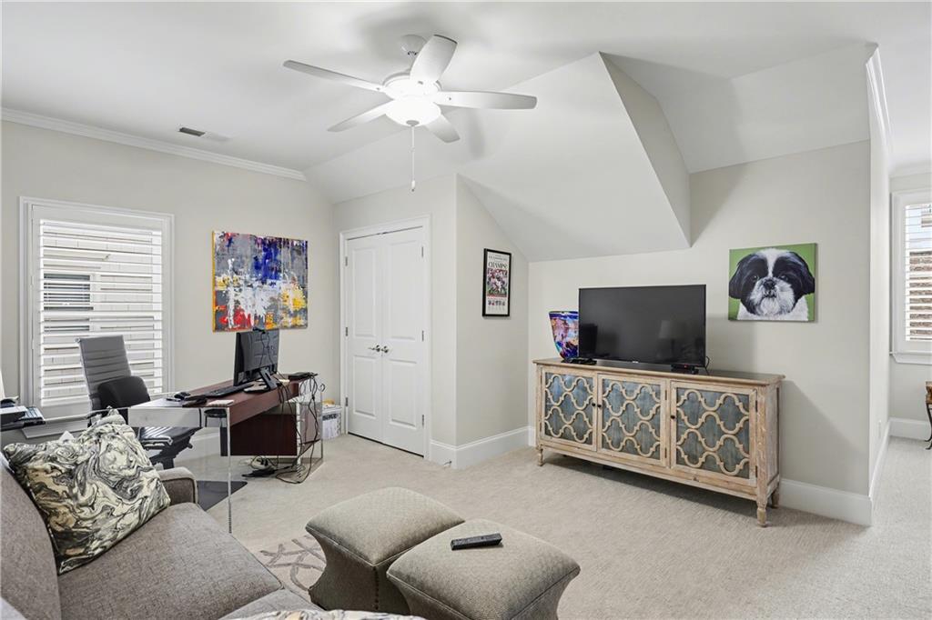 317 Riversedge Drive Atlanta, GA 30339 - Photo 27 of 49 a living room with furniture a flat screen tv and a window