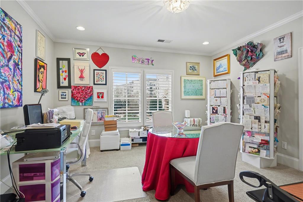 317 Riversedge Drive Atlanta, GA 30339 - Photo 28 of 49 a living room with furniture a flat screen tv and a table