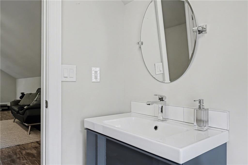 317 Riversedge Drive Atlanta, GA 30339 - Photo 33 of 49 a bathroom with a sink and a mirror