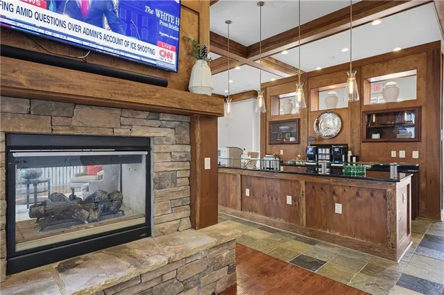 a kitchen with stainless steel appliances granite countertop a stove and cabinets