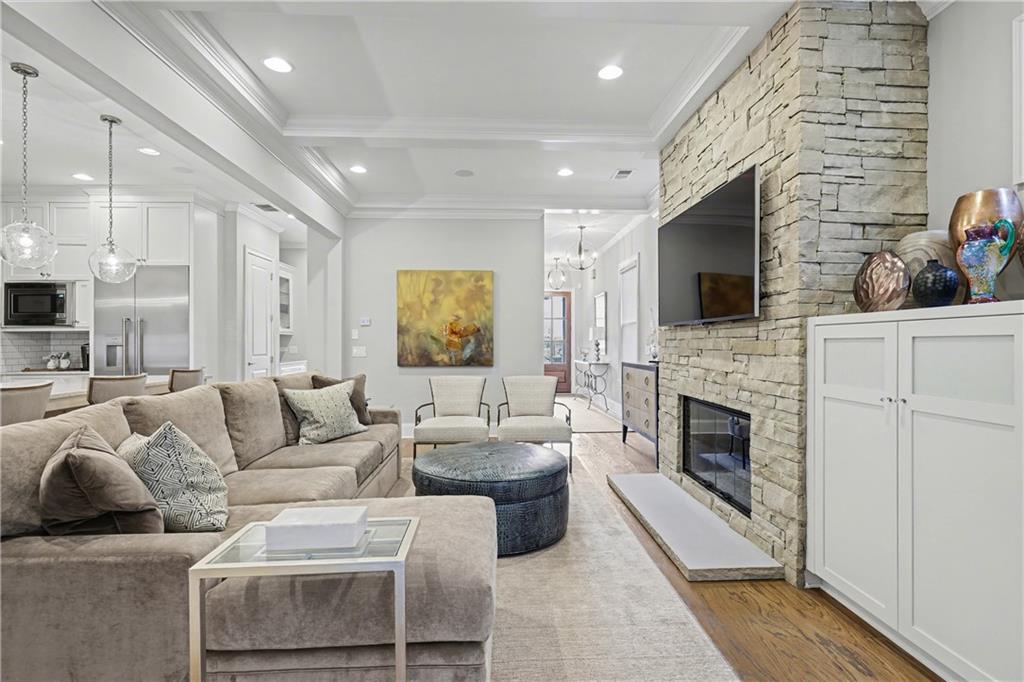 317 Riversedge Drive Atlanta, GA 30339 - Photo 4 of 49 a living room with furniture a fireplace and a flat screen tv