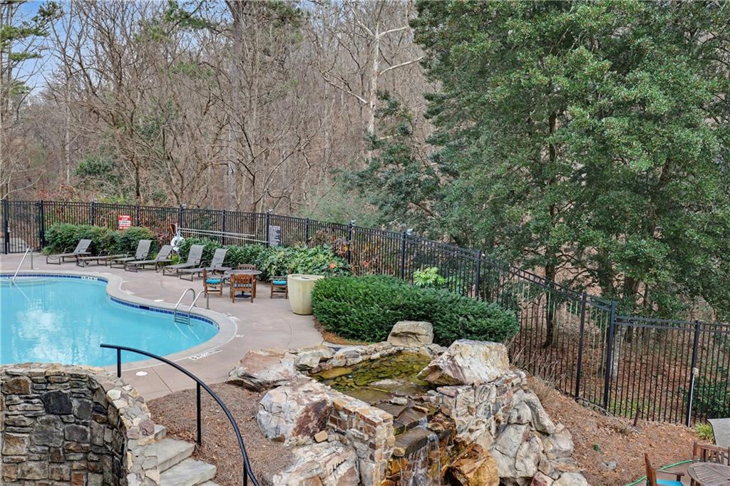 317 Riversedge Drive Atlanta, GA 30339 - Photo 41 of 49 a view of swimming pool with outdoor seating and plants