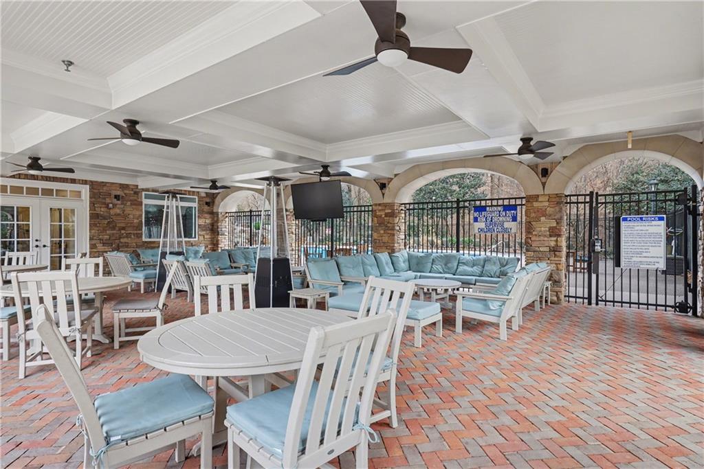 317 Riversedge Drive Atlanta, GA 30339 - Photo 42 of 49 a dinning table and chairs in a patio