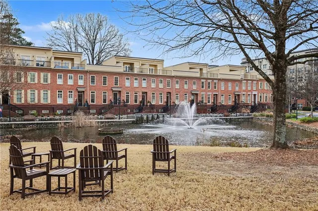 a swimming pool view with a outdoor seating