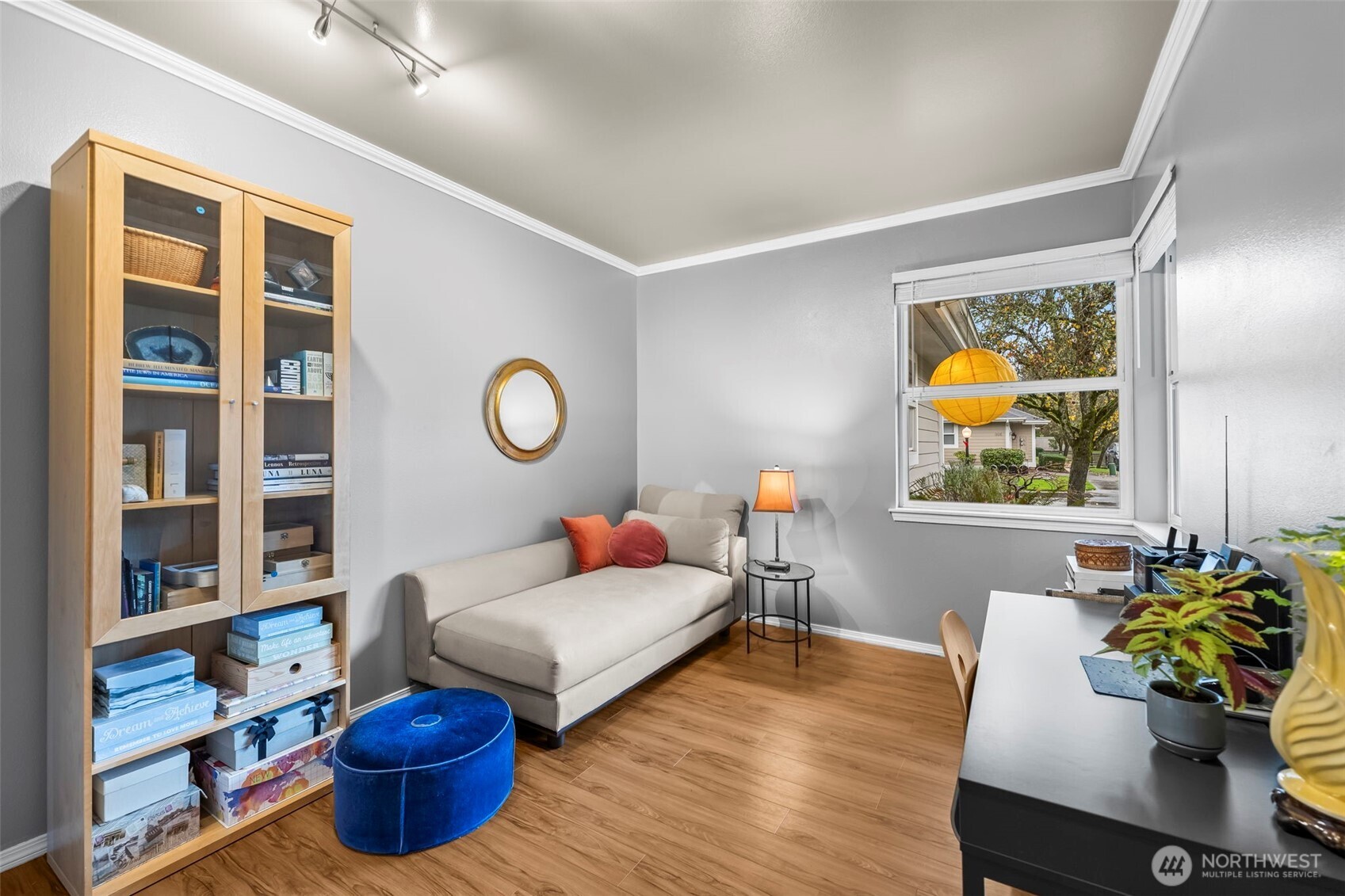 1113 Garden Circle Fircrest, WA 98466 - Photo 21 of 29 a living room with furniture and a bookshelf