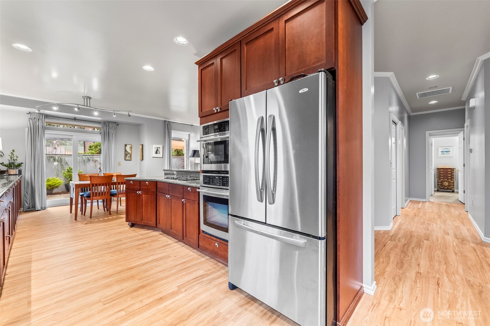 1113 Garden Circle Fircrest, WA 98466 - Photo 3 of 29 a kitchen with stainless steel appliances a refrigerator and wooden floor