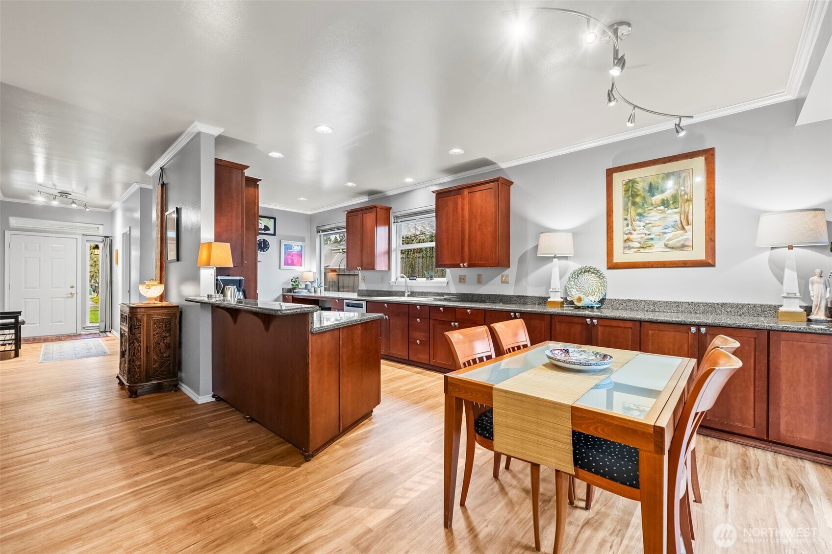 1113 Garden Circle Fircrest, WA 98466 - Photo 7 of 29 a dining room with kitchen island granite countertop wooden floor and stainless steel appliances