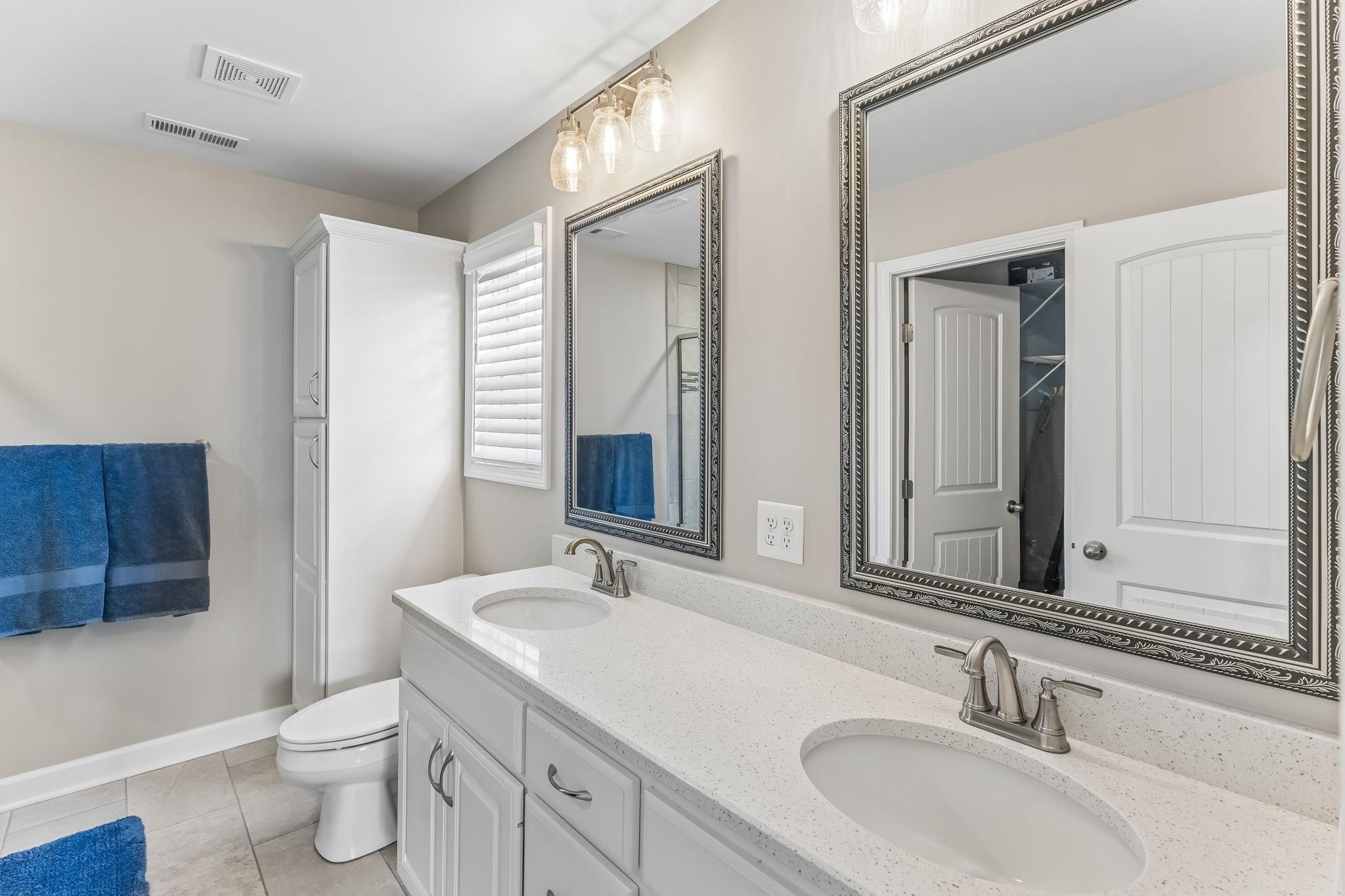 343 Wildcat Run Gallatin, TN 37066 - Photo 13 of 29 a bathroom with a double vanity sink a toilet and a mirror