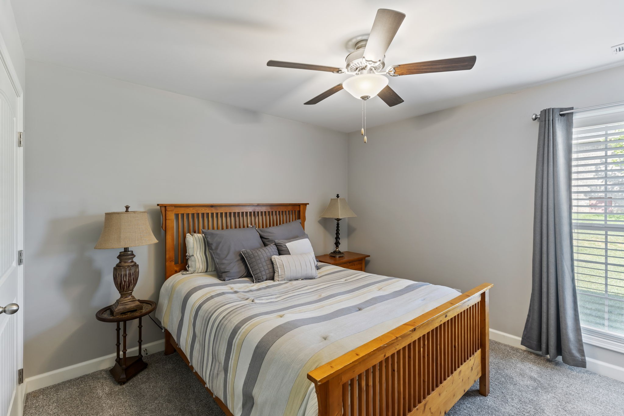 343 Wildcat Run Gallatin, TN 37066 - Photo 16 of 29 a bedroom with a large bed and a chandelier