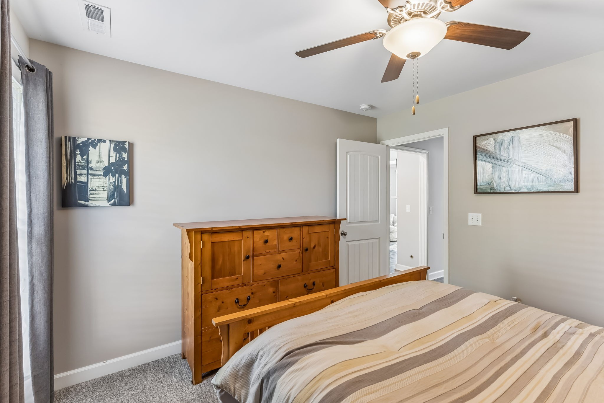 343 Wildcat Run Gallatin, TN 37066 - Photo 17 of 29 a bedroom with a bed and a chandelier