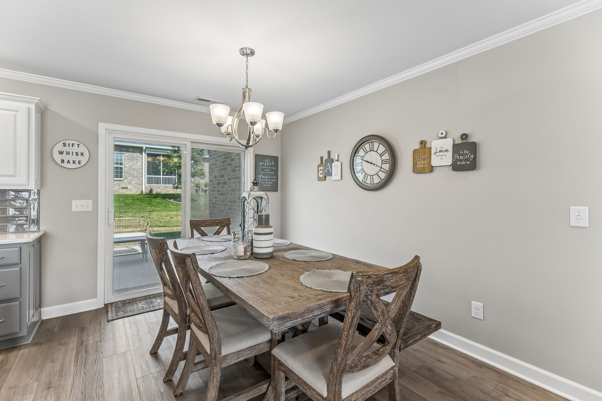 343 Wildcat Run Gallatin, TN 37066 - Photo 6 of 29 a view of a dining room with furniture a chandelier and wooden floor