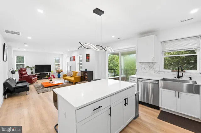 a view of a chairs and table in the balcony