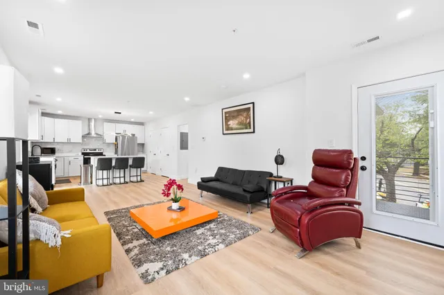 a view of balcony with wooden floor and fence