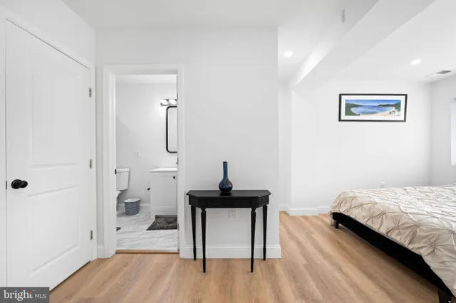 a bedroom with a bed and a table