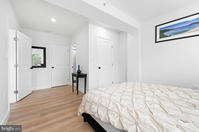 a bedroom with a bed and a table