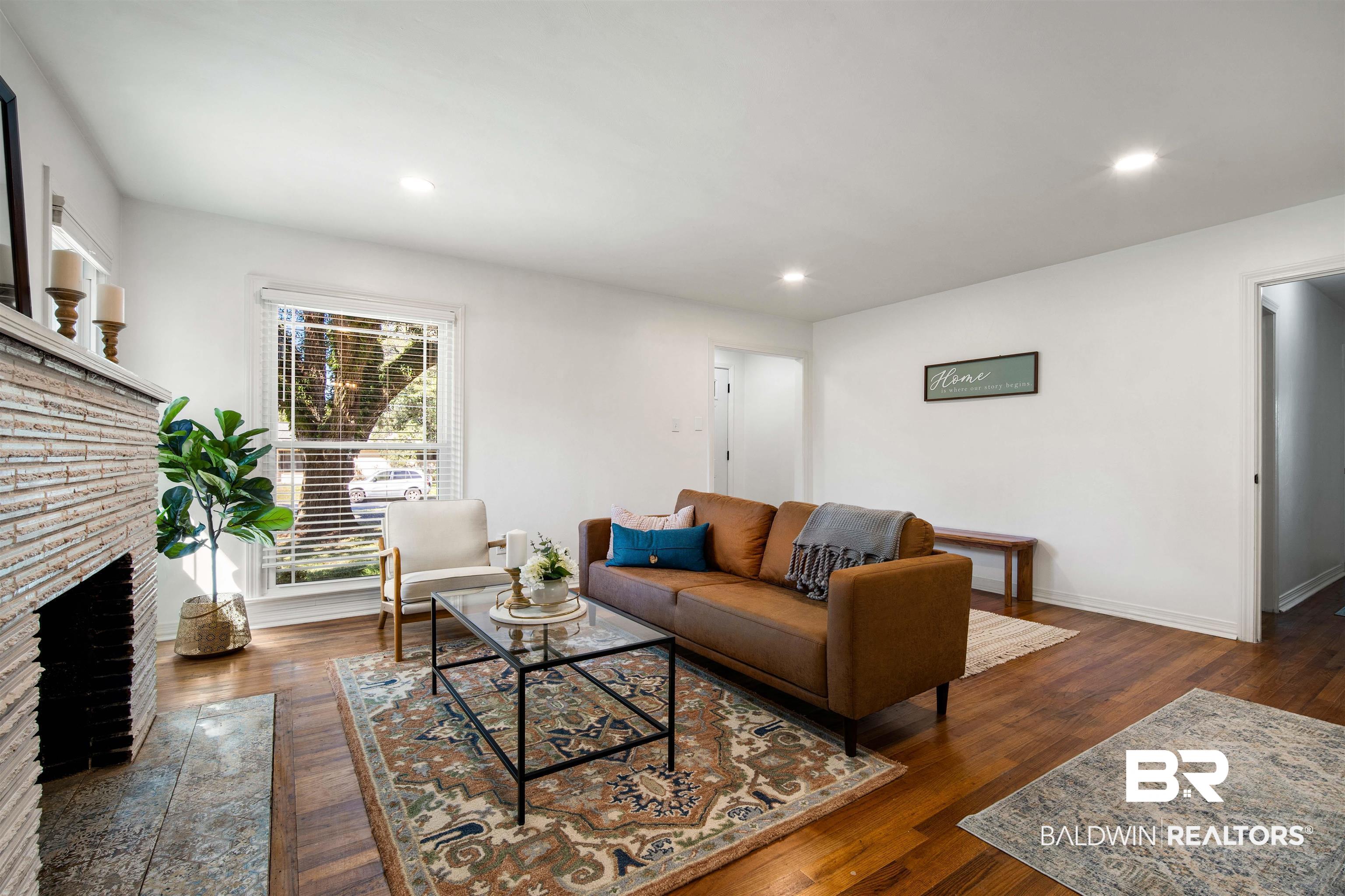 2615 Walton Avenue Mobile, AL 36606 - Photo 7 of 33 Living room featuring recessed lighting, wood-type flooring, a fireplace, and baseboards