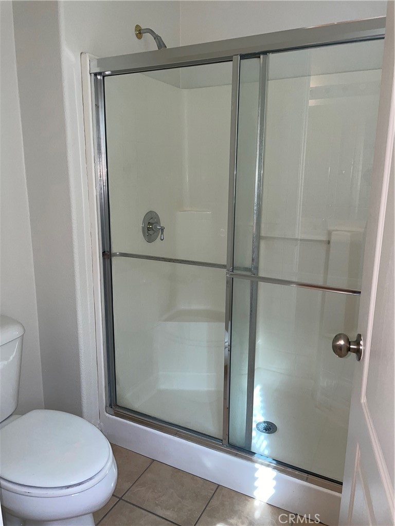 12661 Luna Road Victorville, CA 92392 - Photo 14 of 20 a bathroom with a toilet and a shower