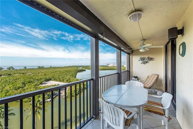 a view of a chairs and table in patio