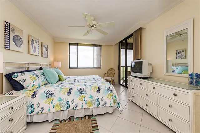 a bedroom with a bed and a dresser in it