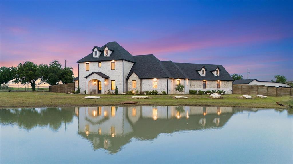 a view of a lake with a building in the background