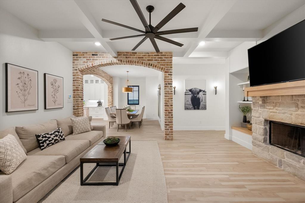 1911 Ozro Road Venus, TX 76084 - Photo 11 of 40 a living room with furniture a flat screen tv and a fireplace
