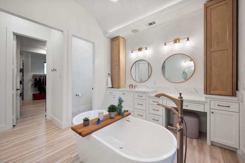 1911 Ozro Road Venus, TX 76084 - Photo 20 of 40 a bathroom with a toilet a sink and a mirror
