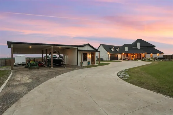 a view of house with outdoor space and car parked