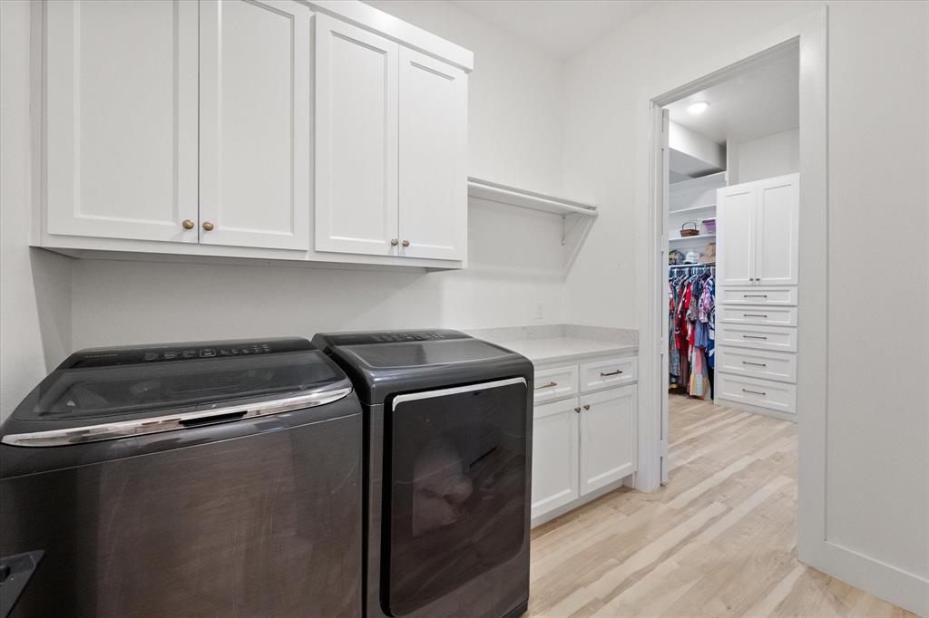 1911 Ozro Road Venus, TX 76084 - Photo 22 of 40 a utility room with dryer and washer