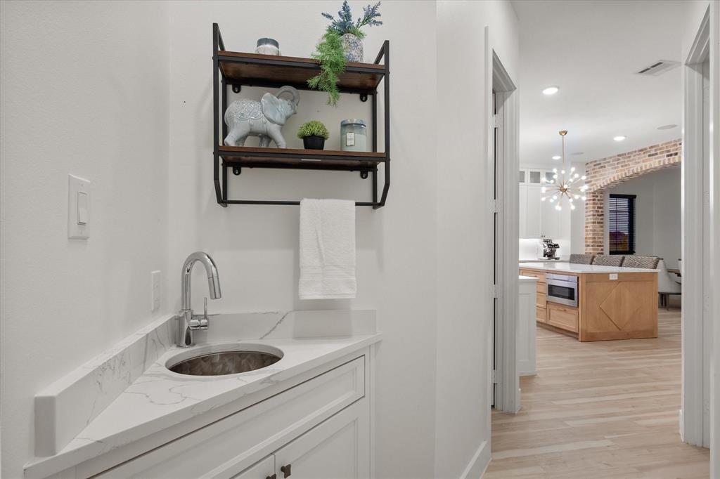 1911 Ozro Road Venus, TX 76084 - Photo 25 of 40 a bathroom with a sink and a mirror