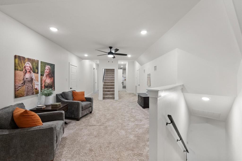 1911 Ozro Road Venus, TX 76084 - Photo 26 of 40 a living room with furniture and a chandelier