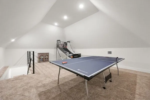 a bedroom with a bed and a table in it
