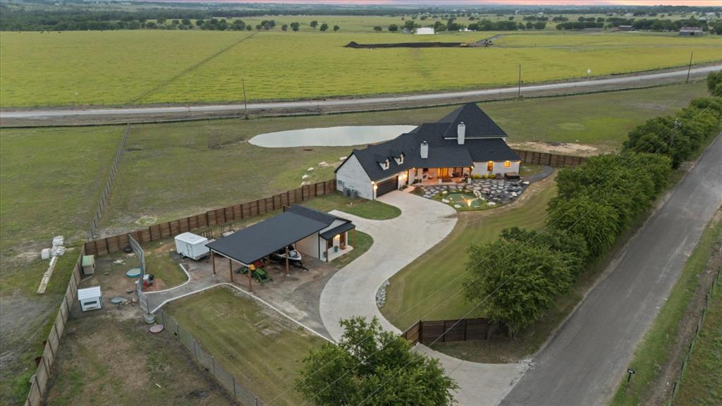 1911 Ozro Road Venus, TX 76084 - Photo 37 of 40 a view of a swimming pool with outdoor seating and yard