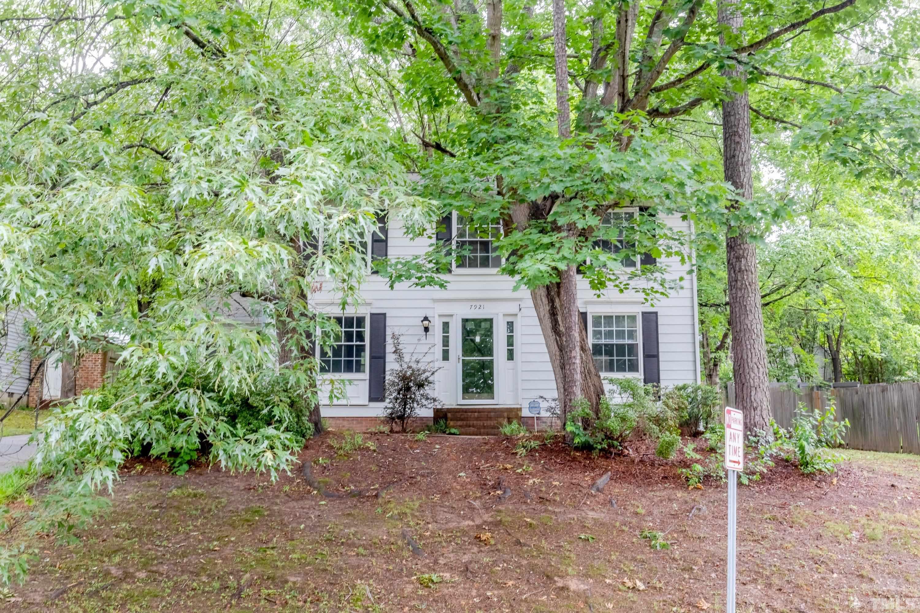 7921 Mourning Dove Road Raleigh, NC 27615 - Photo 50 of 52 front view of a house with a tree