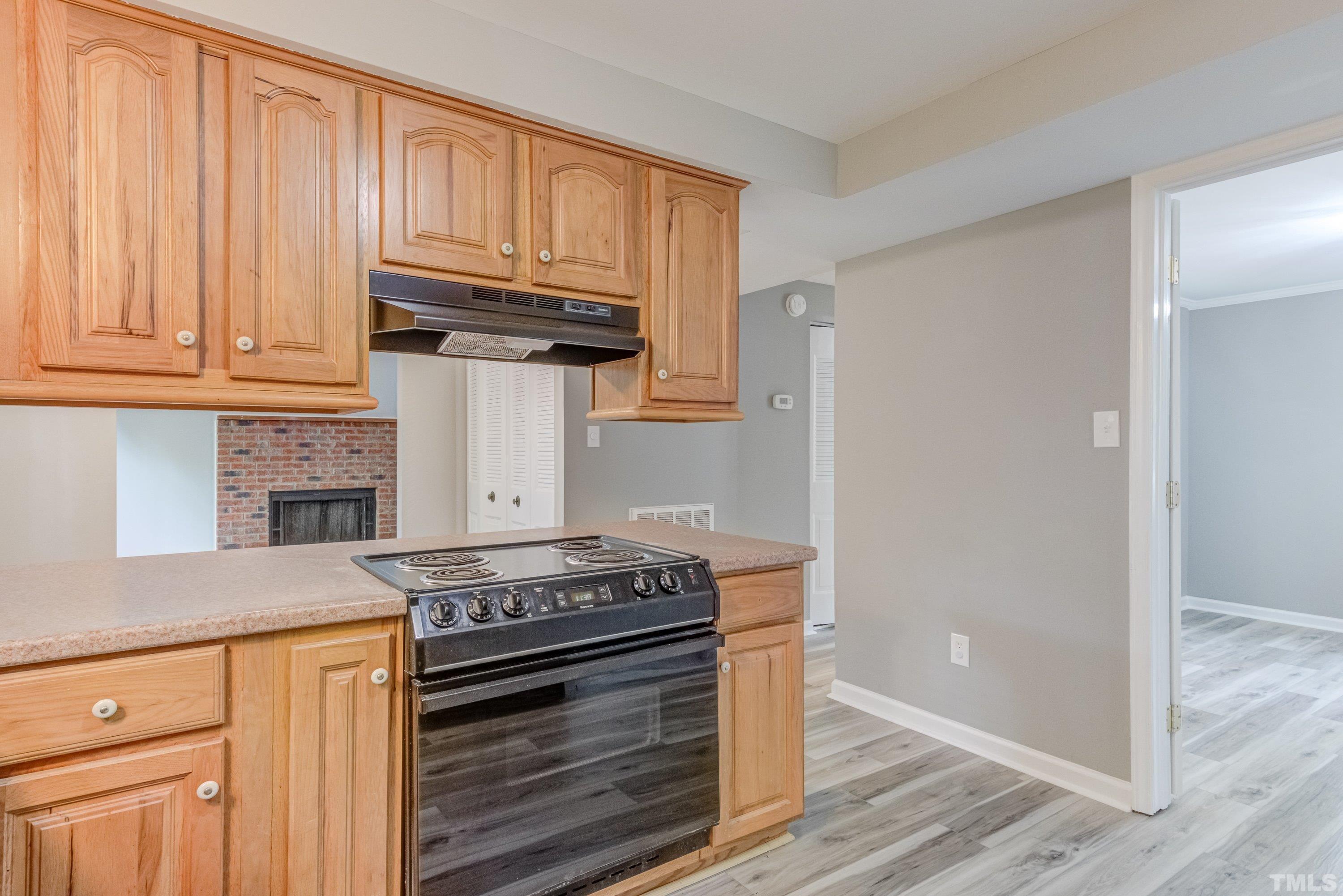 7921 Mourning Dove Road Raleigh, NC 27615 - Photo 8 of 52 a kitchen with granite countertop cabinets and steel stainless steel appliances