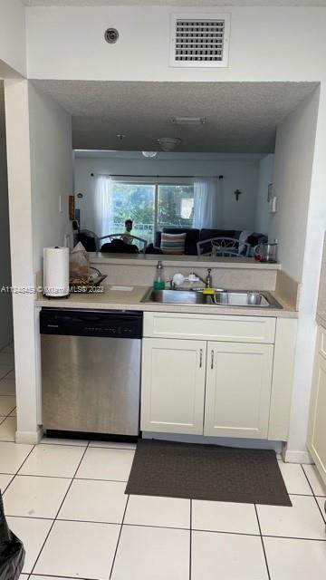 219 Riviera Circle, Unit 219 Weston, FL 33326 - Photo 6 of 22 a kitchen with a sink and cabinets