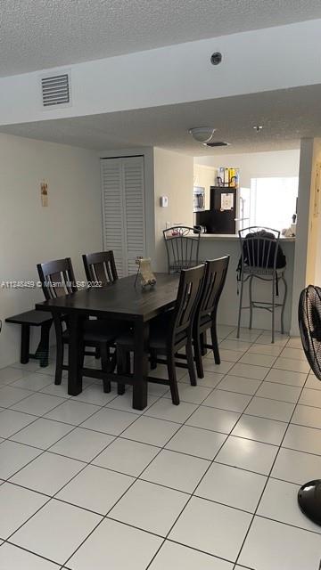 219 Riviera Circle, Unit 219 Weston, FL 33326 - Photo 7 of 22 a view of a dining room with furniture