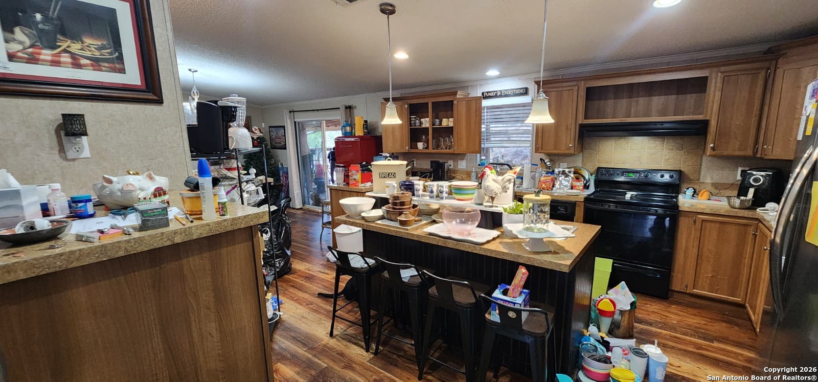 6020 Apache Moon Spring Branch, TX 78070 - Photo 3 of 22 a kitchen that has a lot of cabinets a sink and appliances in it