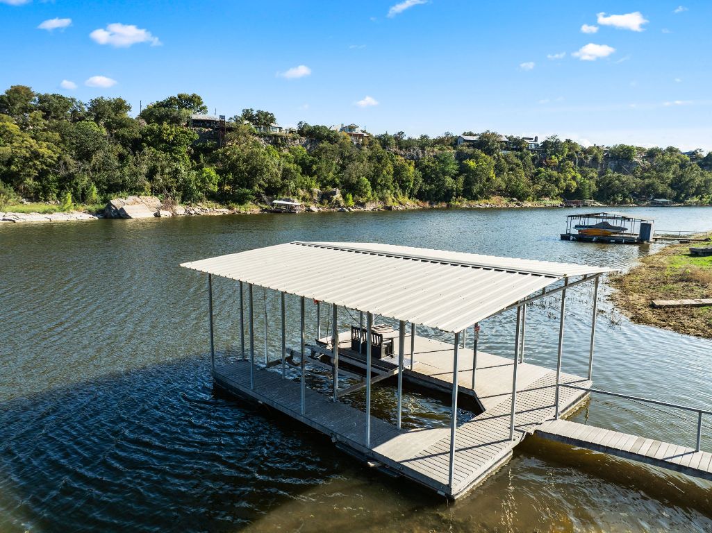 Dock with a water view and boat lift