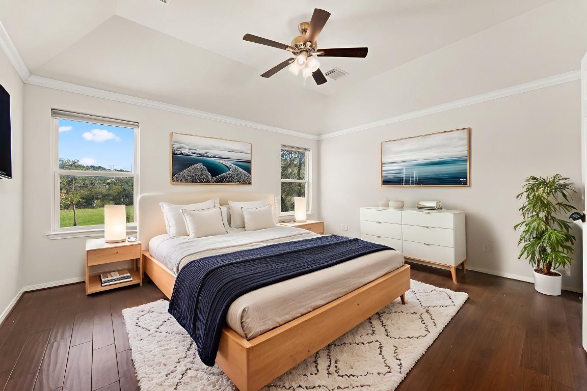 2201 Improver Road Spicewood, TX 78669 - Photo 15 of 26 a bedroom with a bed and a flat screen tv